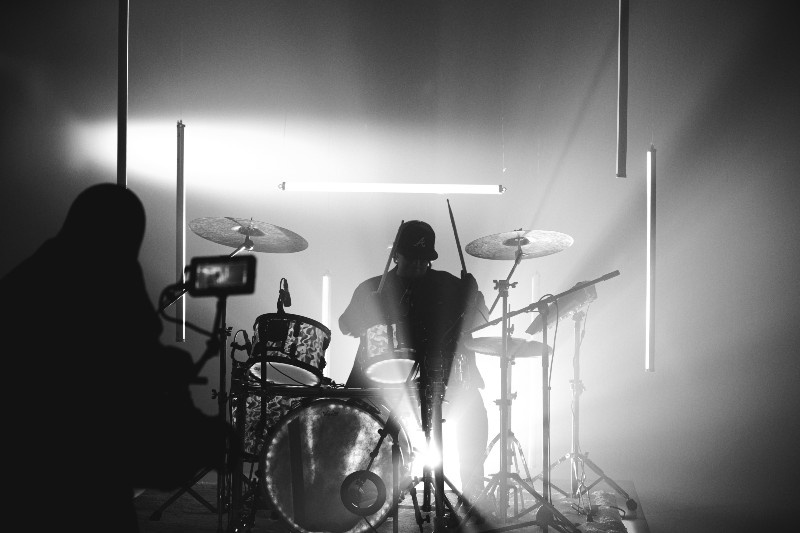 Top 10 Drumming Techniques to Level Up Your Career - Drummer playing on kit