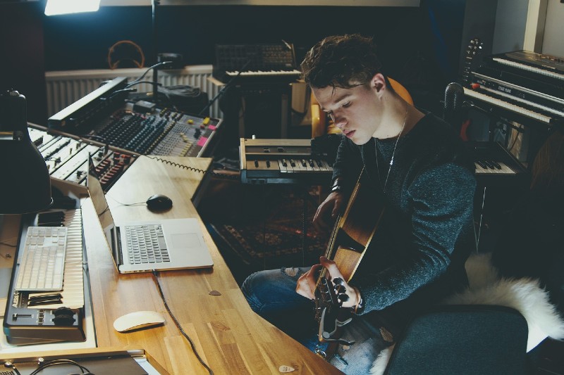 How to Become a Music Producer - musician in studio