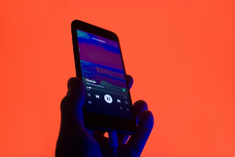 10 Best Spotify Playlist Curators to Send Your Music To - song playing on phone