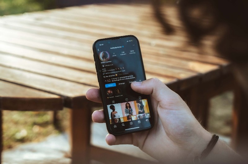 4 Steps to Secure Artist Interviews - Instagram user on mobile