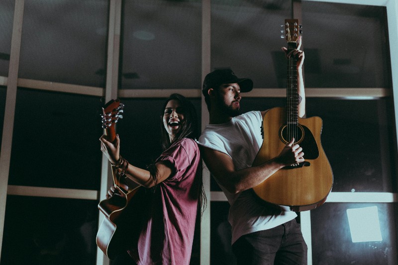 How to Split Royalties with Producers and Songwriters - musicians performing back to back