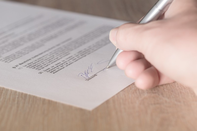 How to Start a Record Label - signing a contract